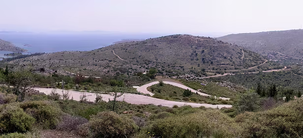 Panorama, links Delfini baai