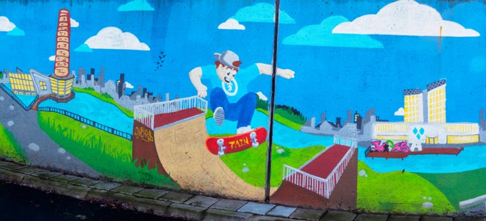 Muurschildering in de fietstunnel naar de Schelfhorst